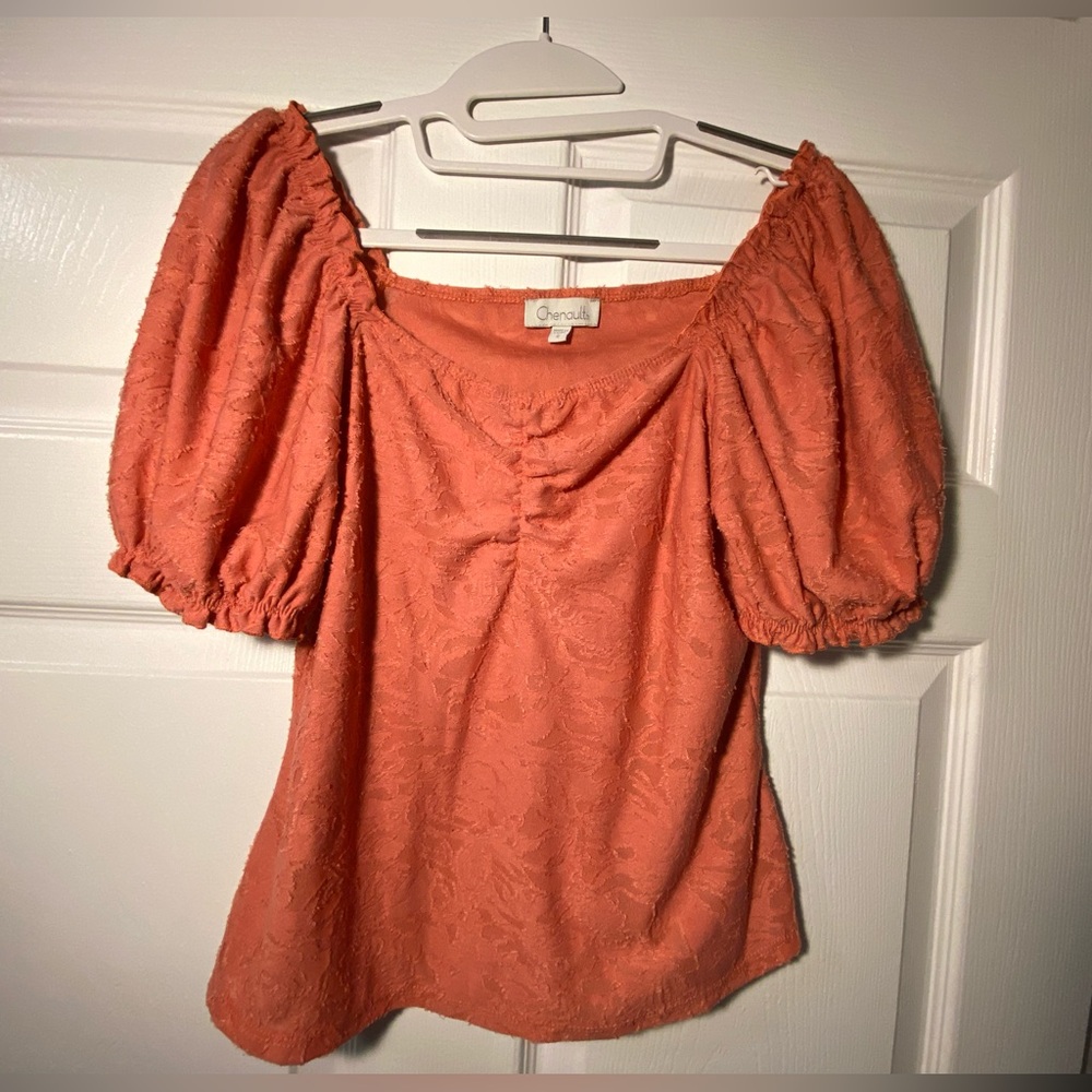 Pink ruffled blouse